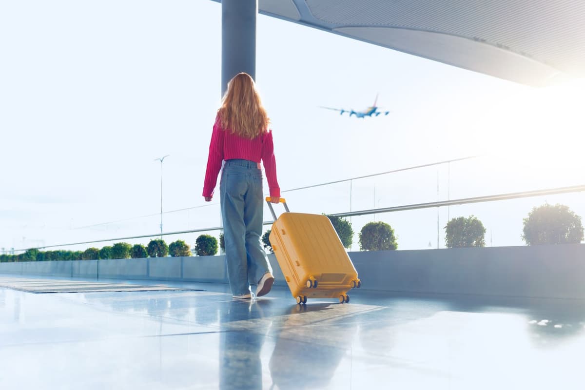 Woman with suitcase and passport